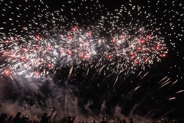 Real Fireworks footage 4k video on Deep Black Background Sky on Futuristic Fireworks festival show...