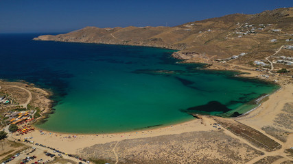 Aerial drone photo of famous tropical bay and beach of Ftelia in the centre of island of Mykonos, Cyclafes, Greece