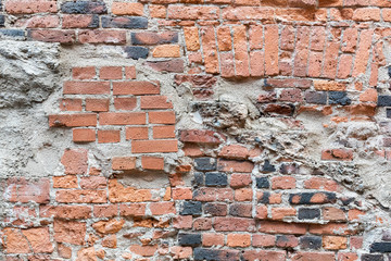 Old damaged worn brick wall background