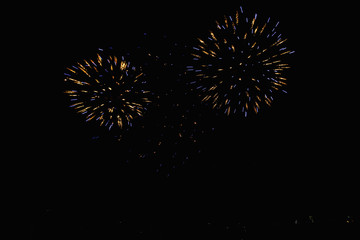 Real Fireworks footage 4k video on Deep Black Background Sky on Futuristic Fireworks festival show before independence day on 4 of July