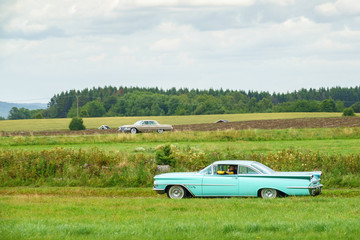 Classic cars driving in the countryside