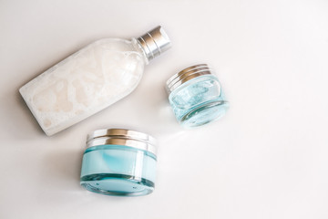 Female skin and body care cosmetic products set flatlay. Overhead, minimalism, beauty blogging concept