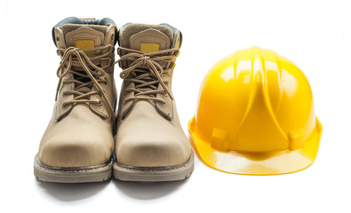 construction tools leather working boots and yellow helmet isolated on white