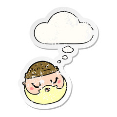 cartoon male face with beard and thought bubble as a distressed worn sticker