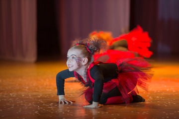 A little girl performs a dance number.Little girl dancing