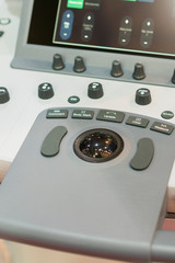 Fototapeta premium Interior of hospital room with ultrasound machine. Interior of examination room with ultrasonography machine in hospital. vertical photo. vertical photo