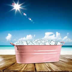 Desk of free space for your decoration and summer beach background with ice cubes 