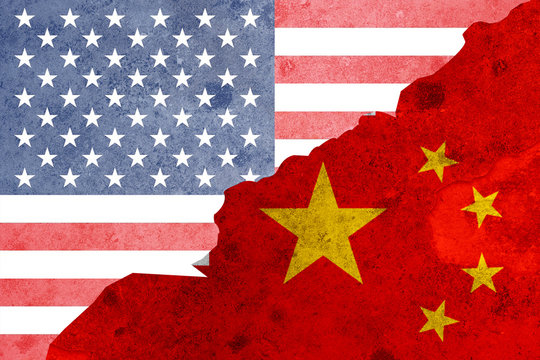 Closeup crack of USA flag and China flag .It is symbol of tariff trade war crisis between United States of America and China which the biggest economic country in the world.
