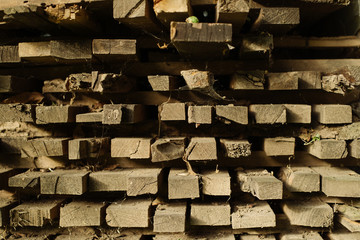 A pile of firewood. Preparation of firewood for the winter and use for cooking, preparation of firewood, Stacks of firewood in the forest. Texture. Web