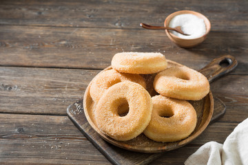 Doughnuts with sugar sprinkles. Rustic style