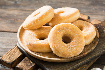 Doughnuts with sugar sprinkles. Rustic style
