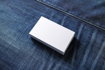 Blank business cards on denim background. Template for branding identity.