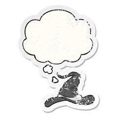 cartoon wizards hat and thought bubble as a distressed worn sticker