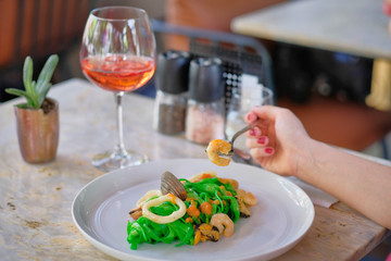 Pasta painted with organic paint, stuffed mussels, squid and rose wine
