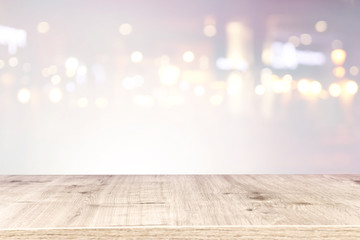 background of wooden table in front of abstract blurred window light