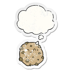 cartoon biscuit and thought bubble as a distressed worn sticker