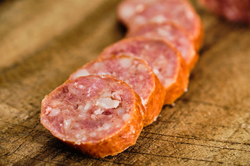 Sliced sausage on cutting board