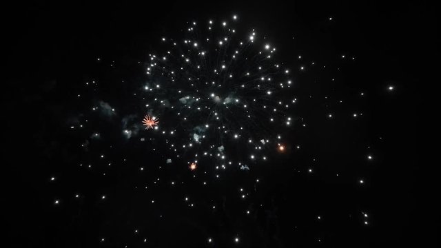 Real Fireworks footage 4k video on Deep Black Background Sky on Futuristic Fireworks festival show before independence day on 4 of July