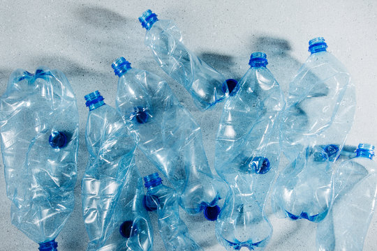 Blue Single Use Plastic Bottles. Concept Of Recycling Plastic And Ecology. Flat Lay, Top View