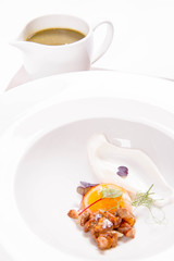 Young sorrel cream with a sous-vide egg yolk, chanterelles and fresh cream, soup served in a jug