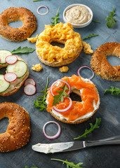 Healthy Bagels breakfast sandwich with salmon, scrambled eggs, vegetables and cream cheese