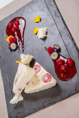Semifreddo with seasonal fruit and rapsberry sauce