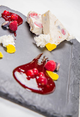 Semifreddo with seasonal fruit and rapsberry sauce