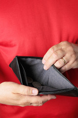 Man holding empty wallet. Deception, debts idea