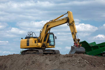 yellow excavator at work