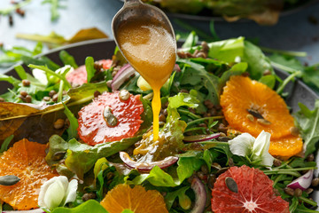 Orange and grapefruit Citrus salad with lentills vertes, wild rocket, arugula, red onion and...