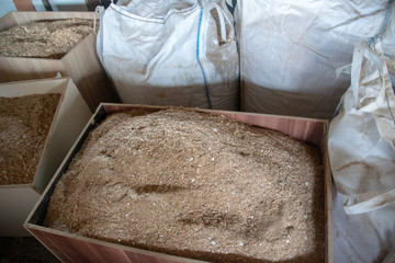 Taking photographs of wood plywood, used for making pellets