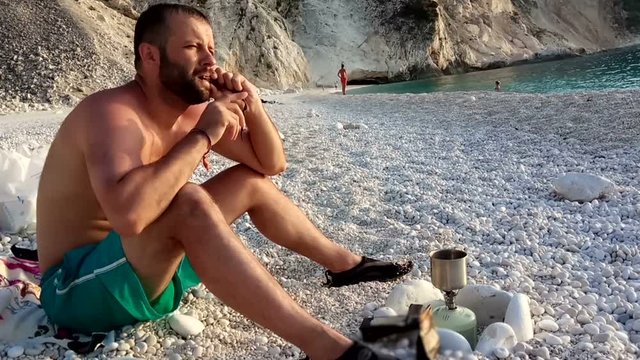 a man playing the harp silja on the beach