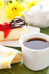 Cherry cheesecake and coffee cup