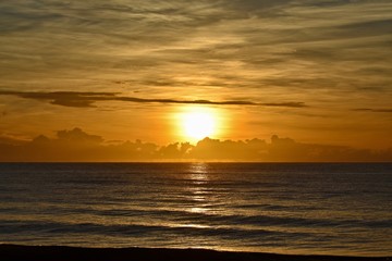 sunrise over the ocean and clouds