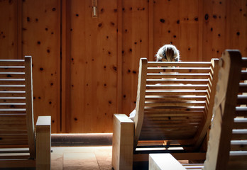 woman sitting in sauna chair