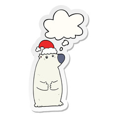 cartoon bear wearing christmas hat and thought bubble as a printed sticker