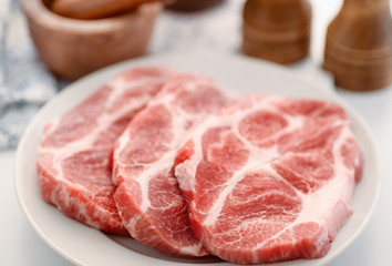 Raw fresh pork neck meat steaks