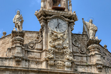 Fototapeta premium Details of the facade of the church of Santos Juanes in front of the Lonja de la Seda, and next to the Central Market in Valencia, Spagna
