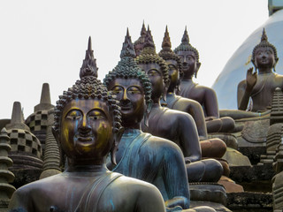 COLOMBO, SRI LANKA - DECEMBER 29, 2015: Buddha statues in Gangaramaya Buddhist Temple.