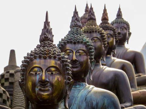 COLOMBO, SRI LANKA - DECEMBER 29, 2015: Buddha statues in Gangaramaya Buddhist Temple.