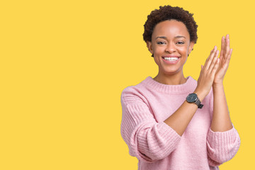 Beautiful young african american woman over isolated background Clapping and applauding happy and joyful, smiling proud hands together