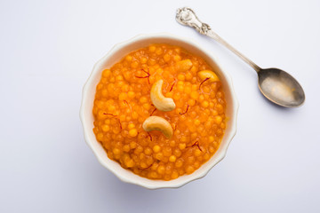 Sabudana or Sago Kesari dessert for Vrat Upvas also known as Sweetened Tapioca Pearl. served in a bowl. selective focus