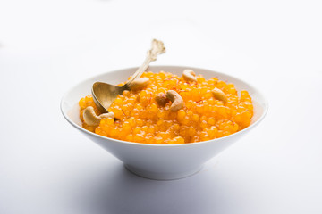 Sabudana or Sago Kesari dessert for Vrat Upvas also known as Sweetened Tapioca Pearl. served in a bowl. selective focus