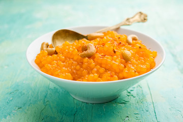 Sabudana or Sago Kesari dessert for Vrat Upvas also known as Sweetened Tapioca Pearl. served in a bowl. selective focus