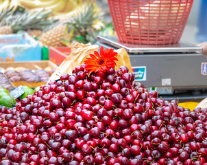 pile of cherries on the market