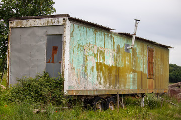 Fototapeta na wymiar old abandoned caravan
