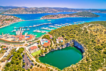 Rogoznica turquoise bay and Dragon Eye lake aerial view