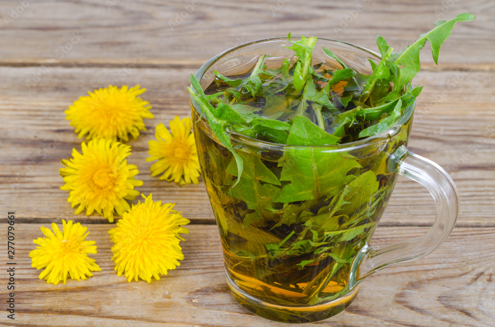 Canvas Prints Cup of tea from fresh dandelion leaves. 