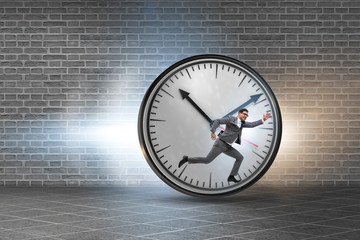 Businessman employee in time management concept