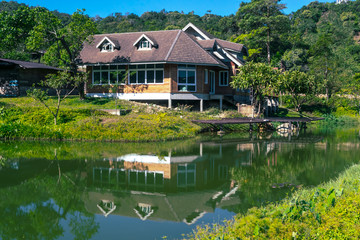 Classic luxury house with water reflection, green garden and canal in Pilok old mining in E-Thong village, Pilok,Thong Pha Phum National Park